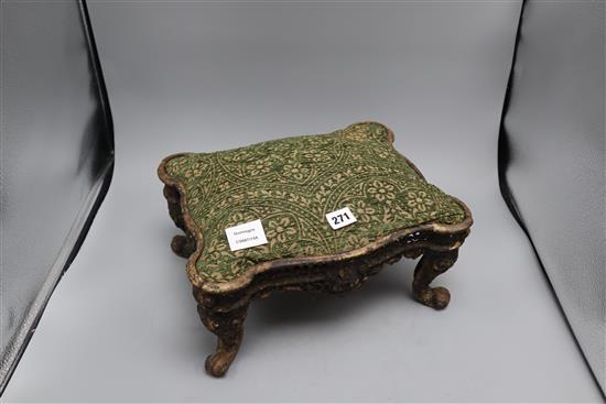 An American cast iron footstool